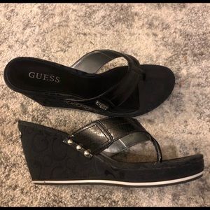 Guess women’s monogram wedge thong heel sandals.  Excellent condition.